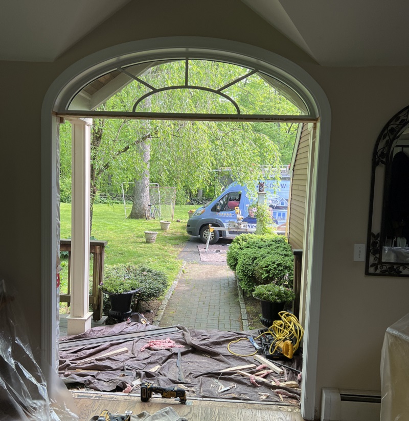 The custom arch was left and the new door was installed underneath 